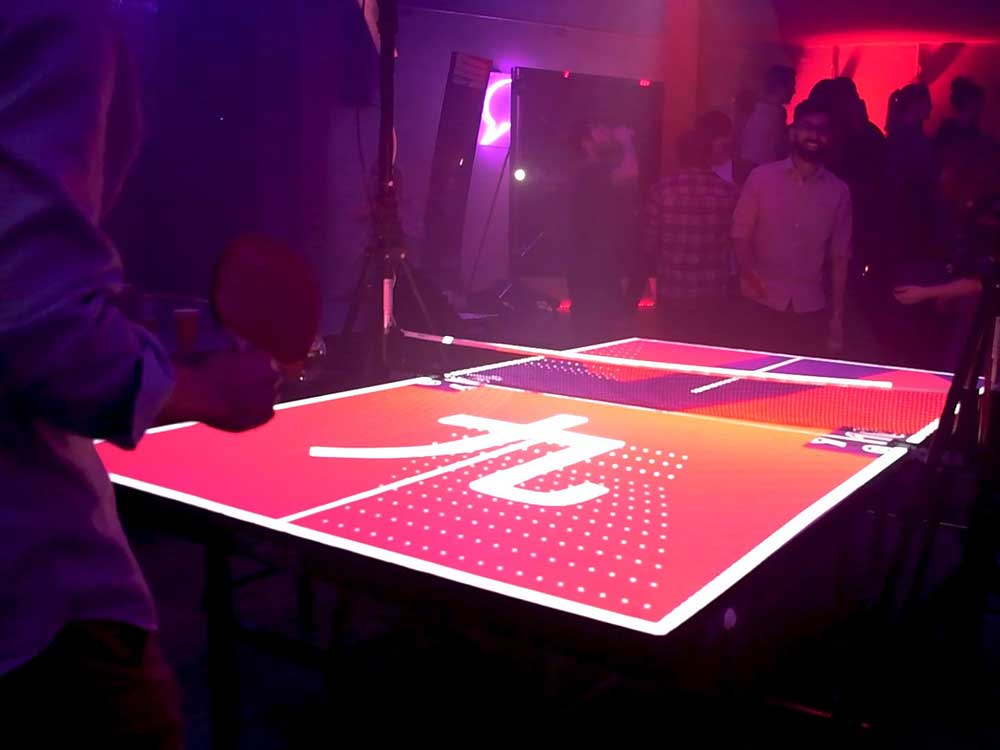 Cover Asahi Interactive Ping Pong Table, with players and projection mapping