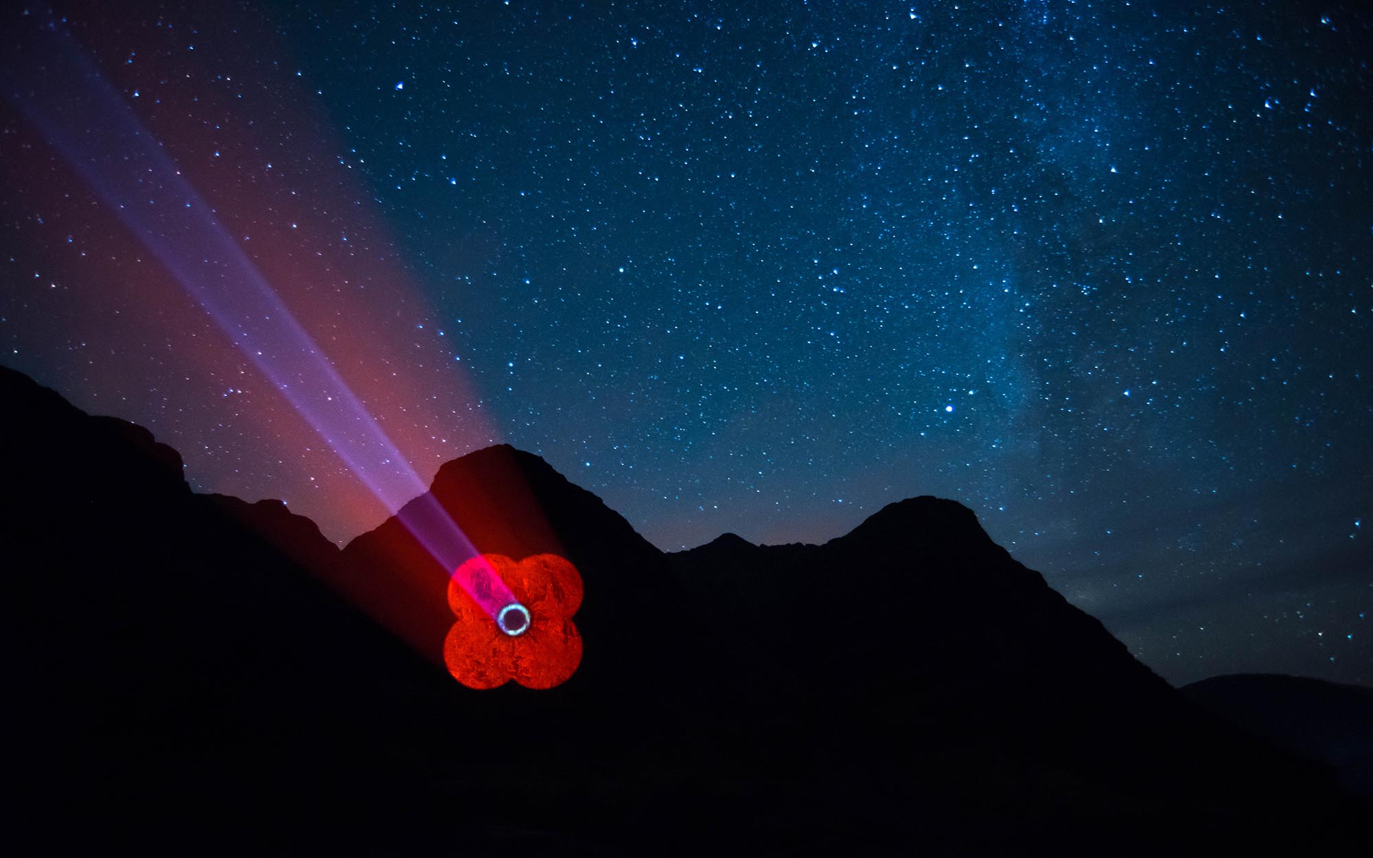 Poppy Scotland logo projected onto Mountain in Glencoe