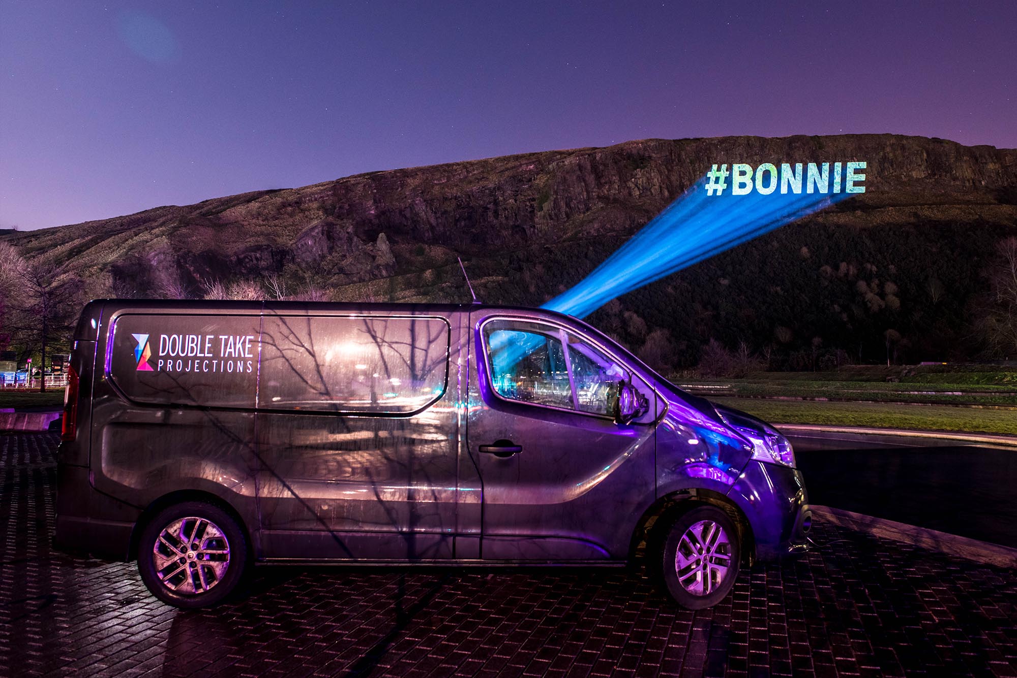 Torchlight Procession Projections, #bonnie beamed on Edinburgh Crags