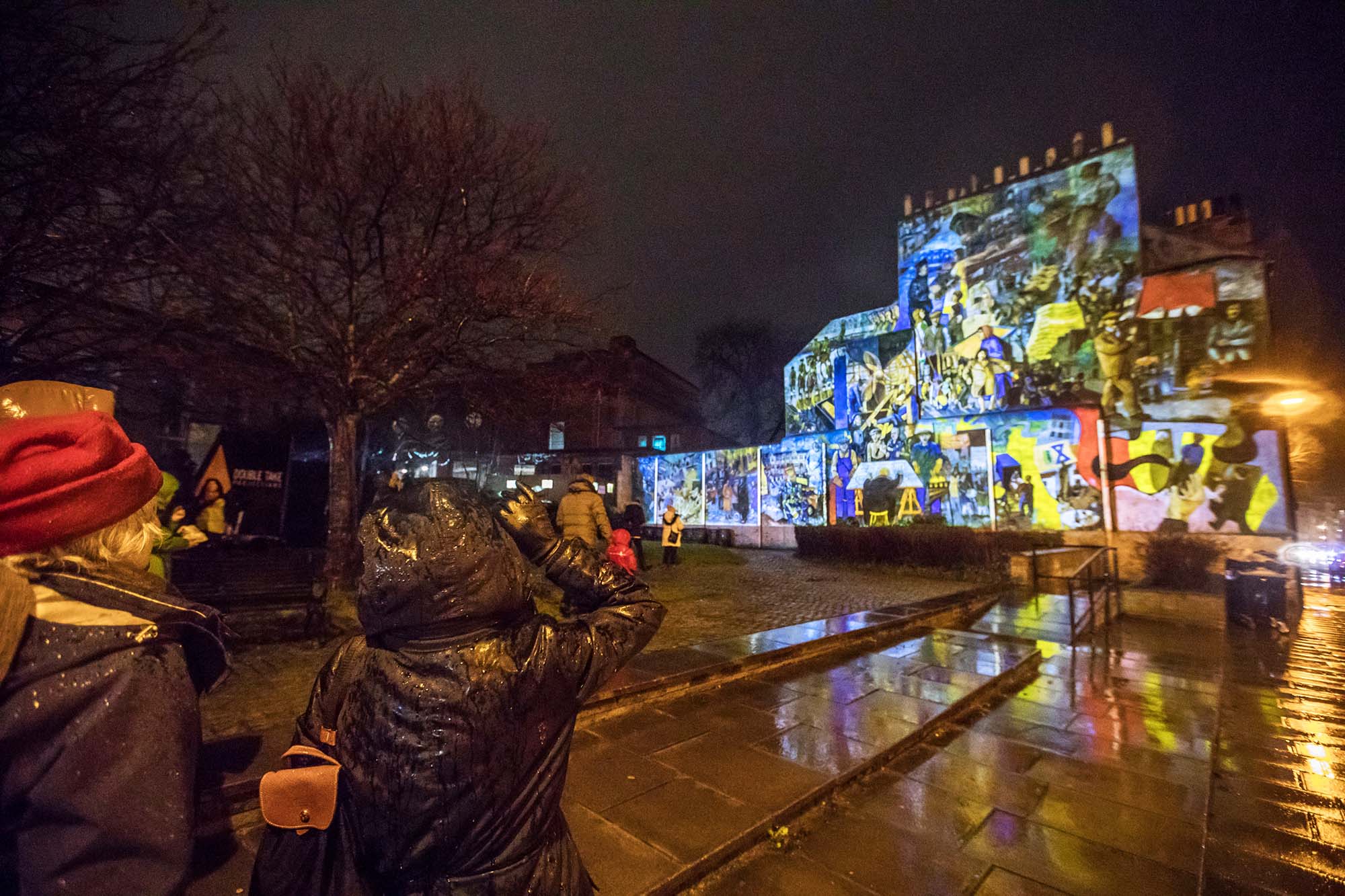 wide angle view of leith mural projection and audience